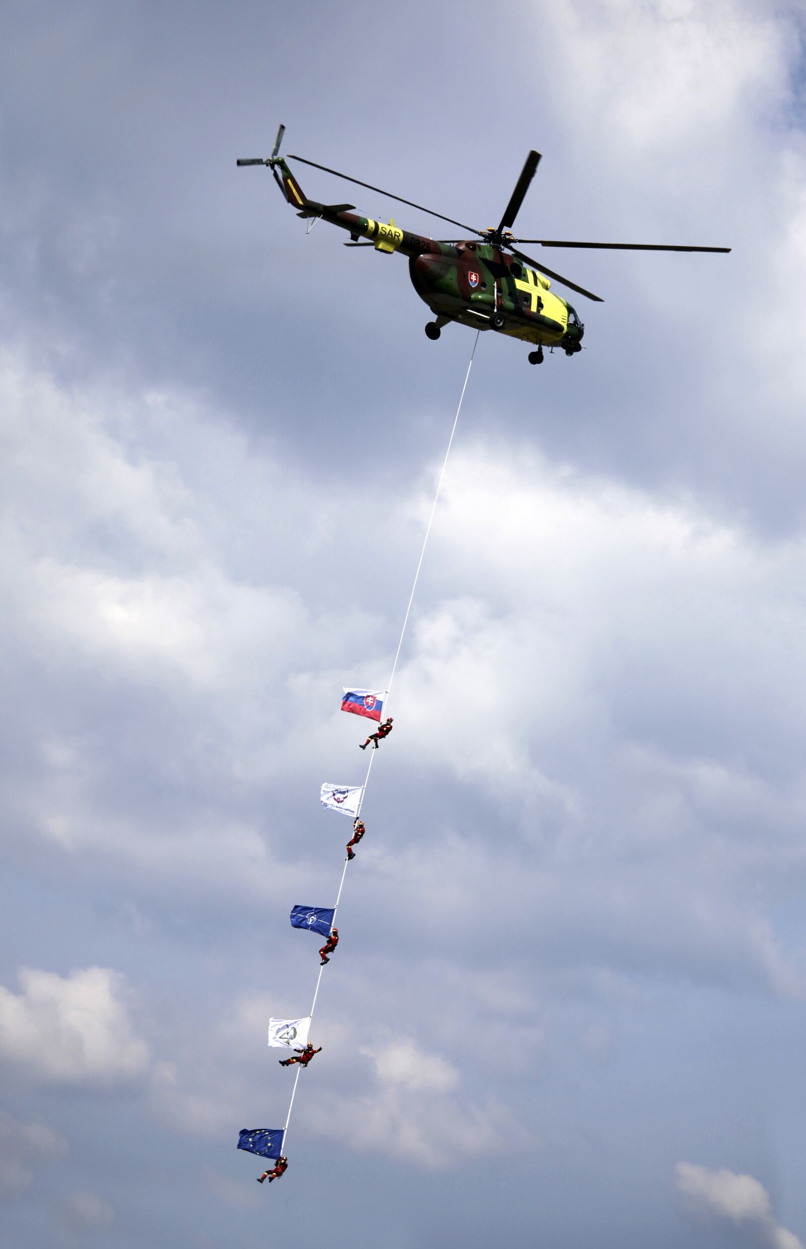 Canon EOS 5D Mark II sample photo. Helicopter, rope, flags photography