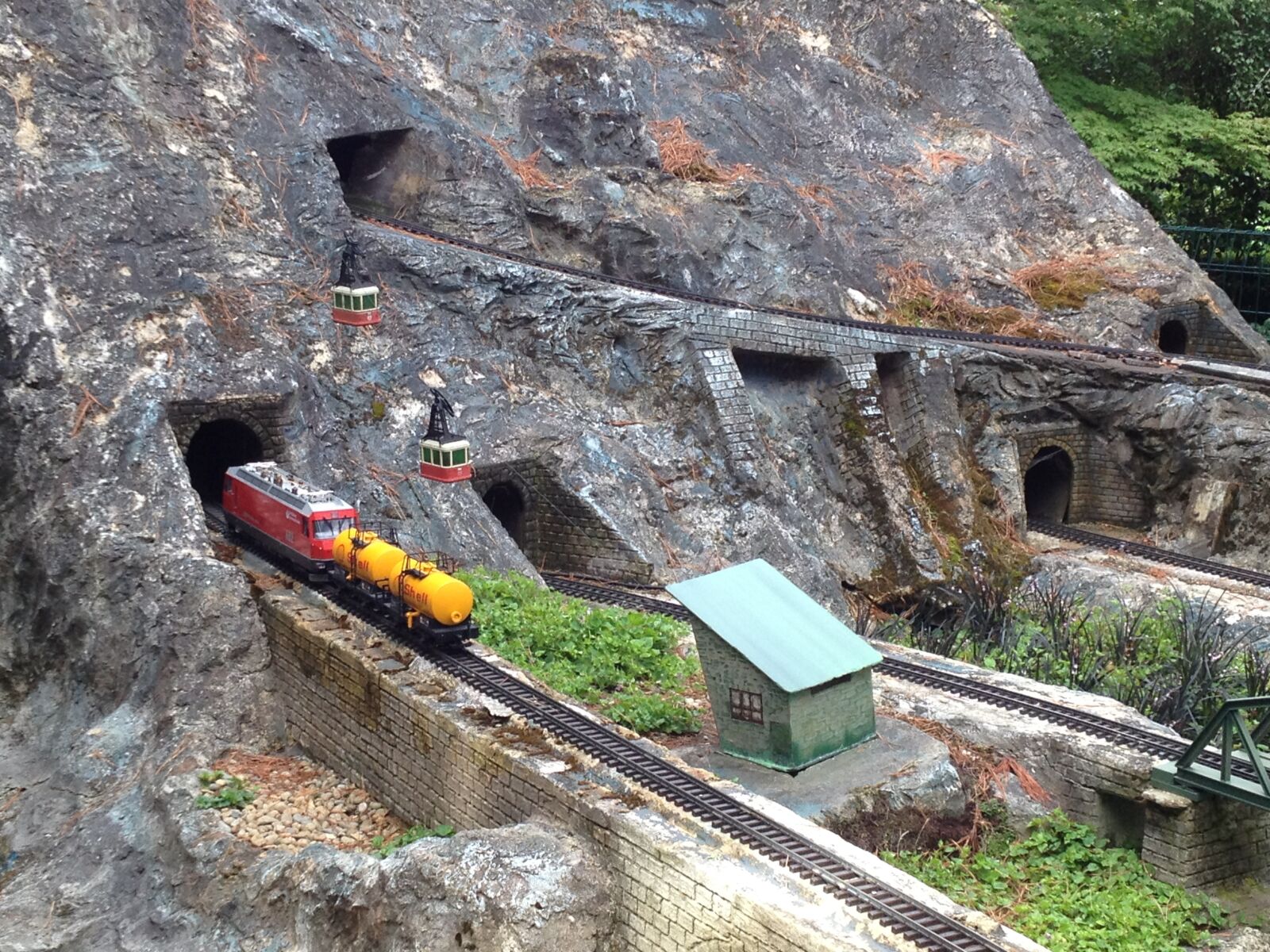 iPhone 4S back camera 4.28mm f/2.4 sample photo. Model train, tunnel, mountain photography