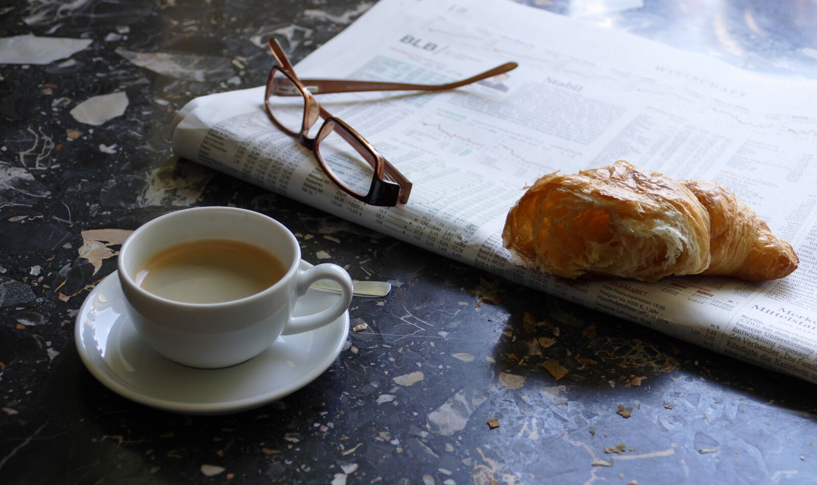 Panasonic Lumix DMC-FZ1000 sample photo. Espresso, newspaper, croissant photography