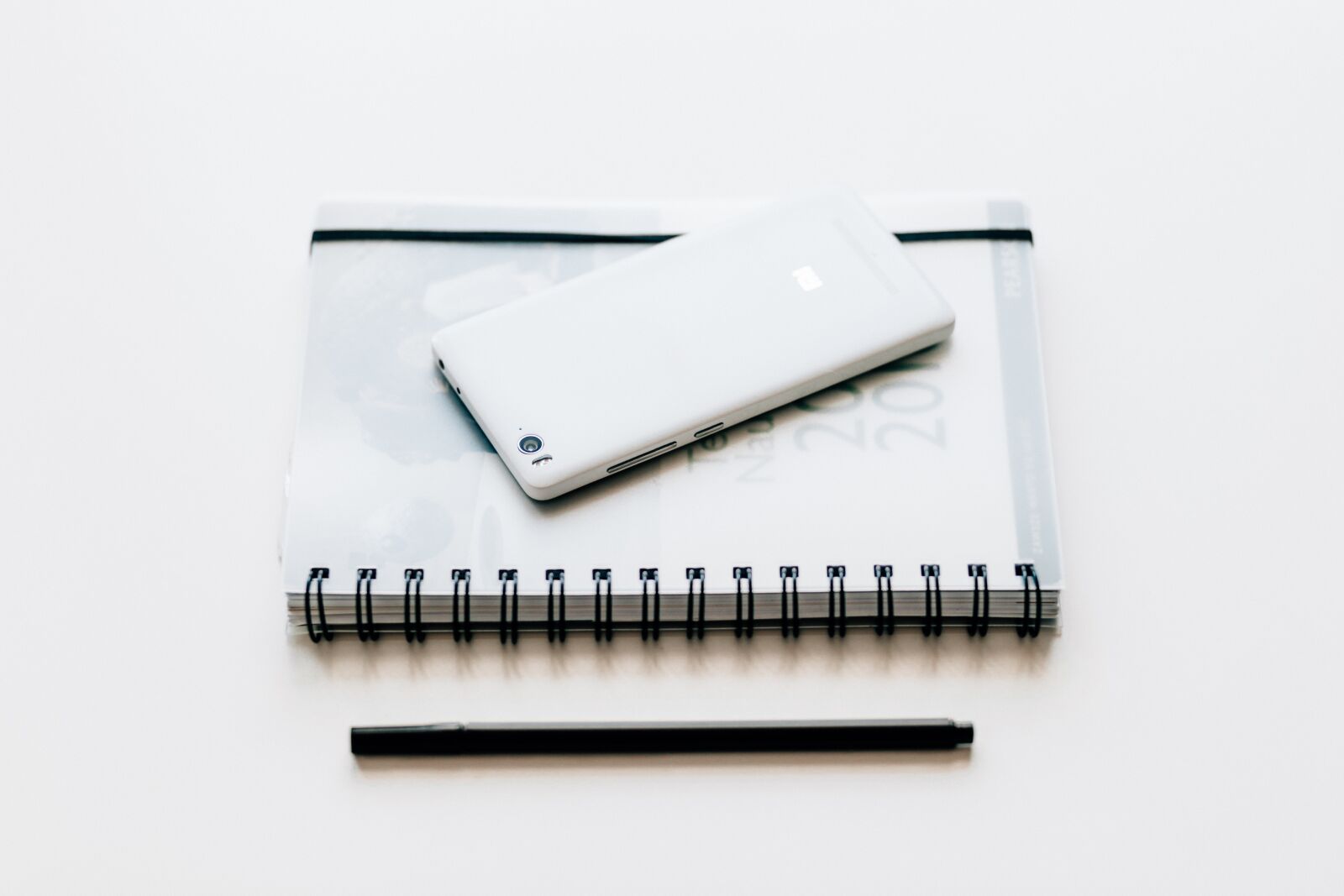Canon EF 85mm F1.8 USM sample photo. Black and white, notebook photography