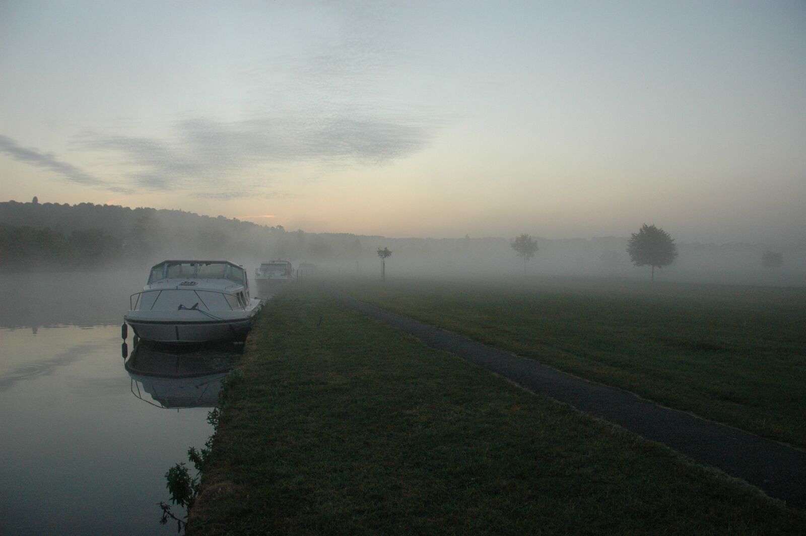 Nikon D70 sample photo. River, boat, mist photography