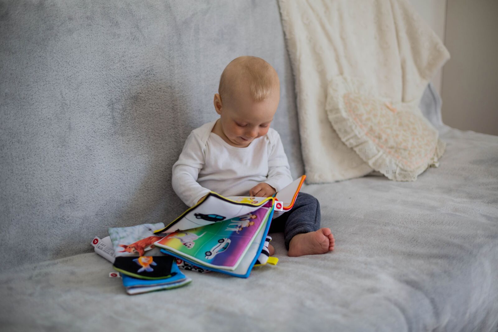 Canon EF 50mm F1.4 USM sample photo. Baby, books, reading photography