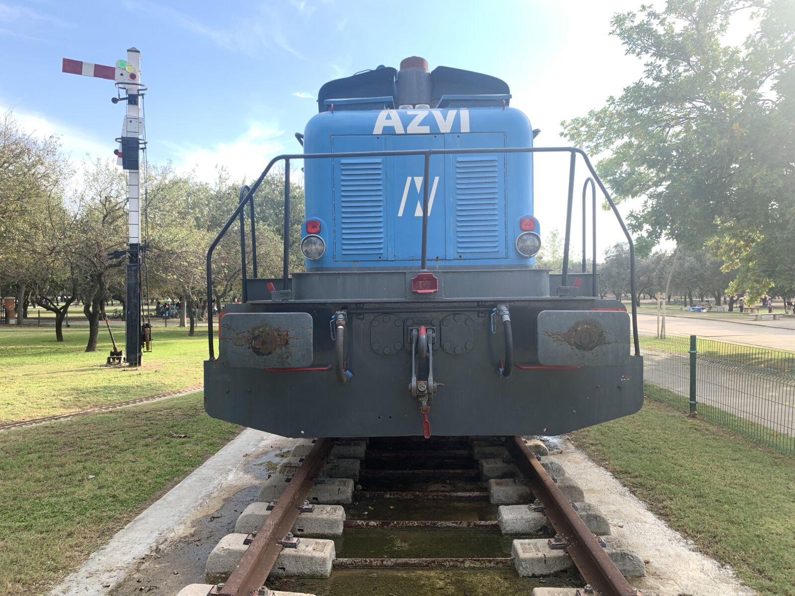 iPhone XS Max back dual camera 4.25mm f/1.8 sample photo. Train, park, blue photography