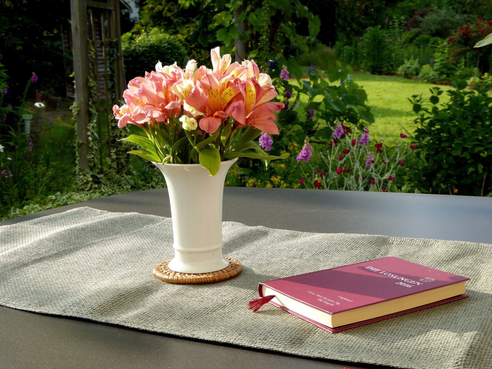 Panasonic DMC-TZ61 sample photo. Flower vase, book, flower photography