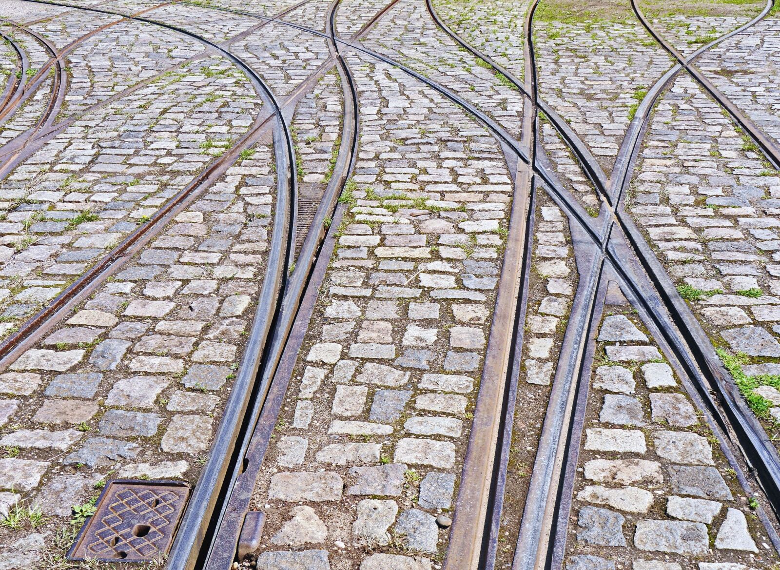 Panasonic Lumix DMC-GH3 sample photo. Rails, paving stone, intersection photography