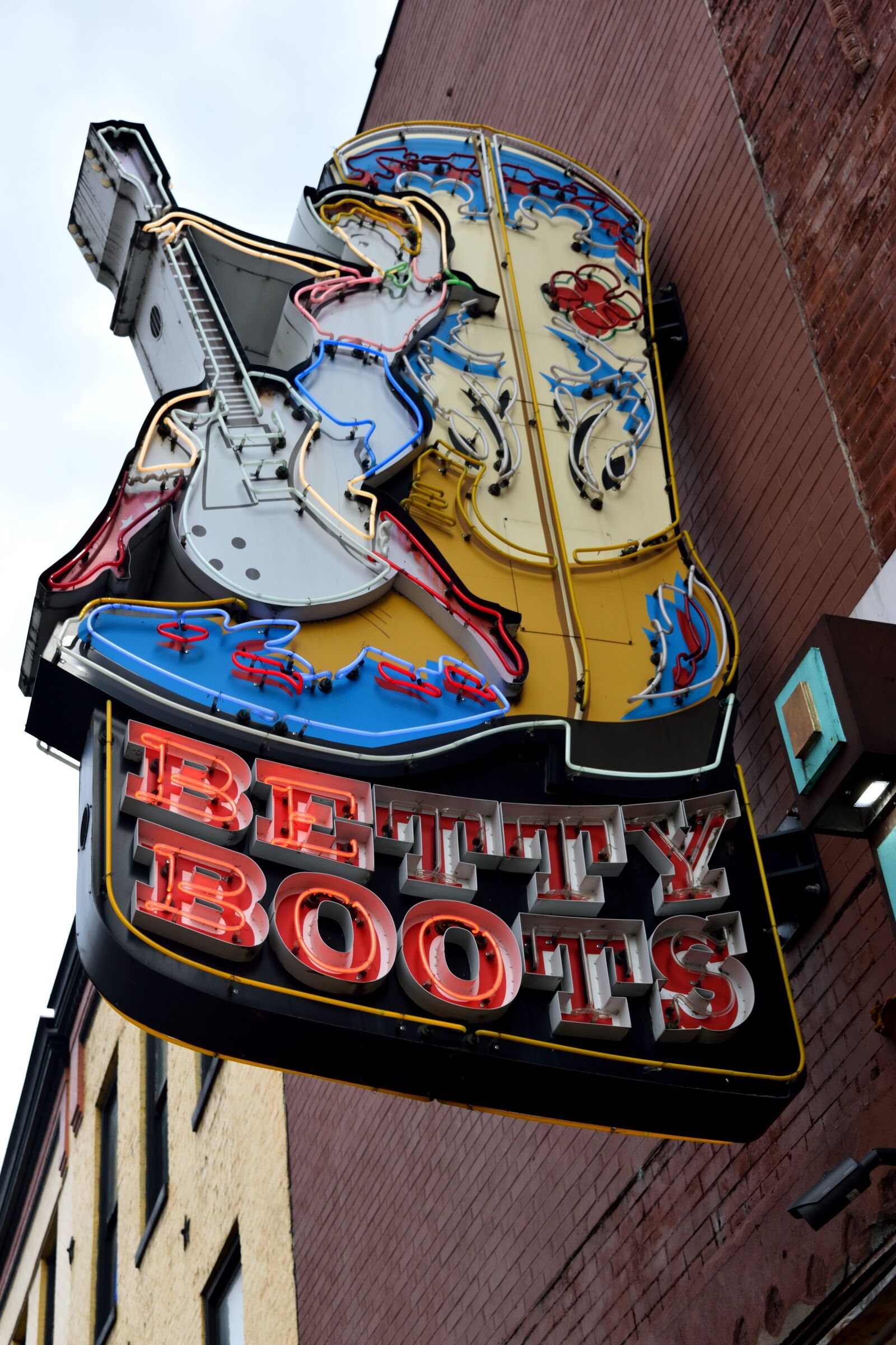 Nikon D3300 sample photo. Neon sign, sign, boots photography