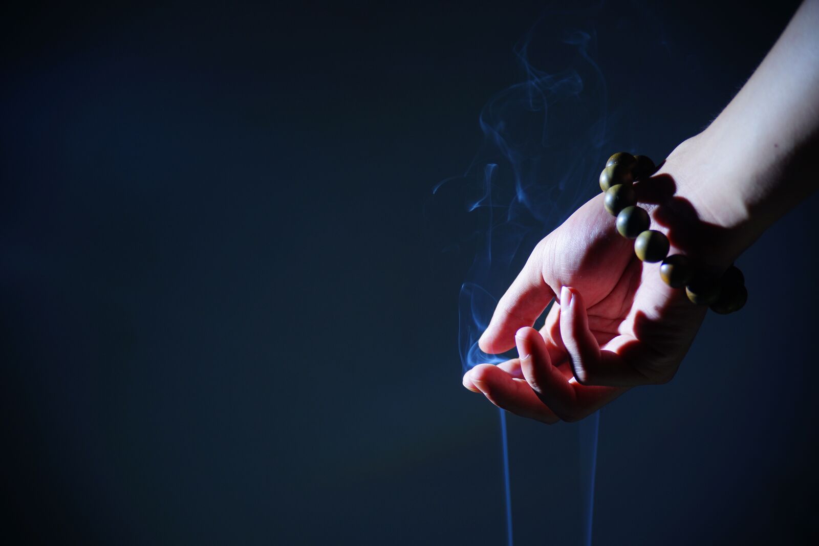 Sony a99 II sample photo. Hand, buddhist prayer beads photography