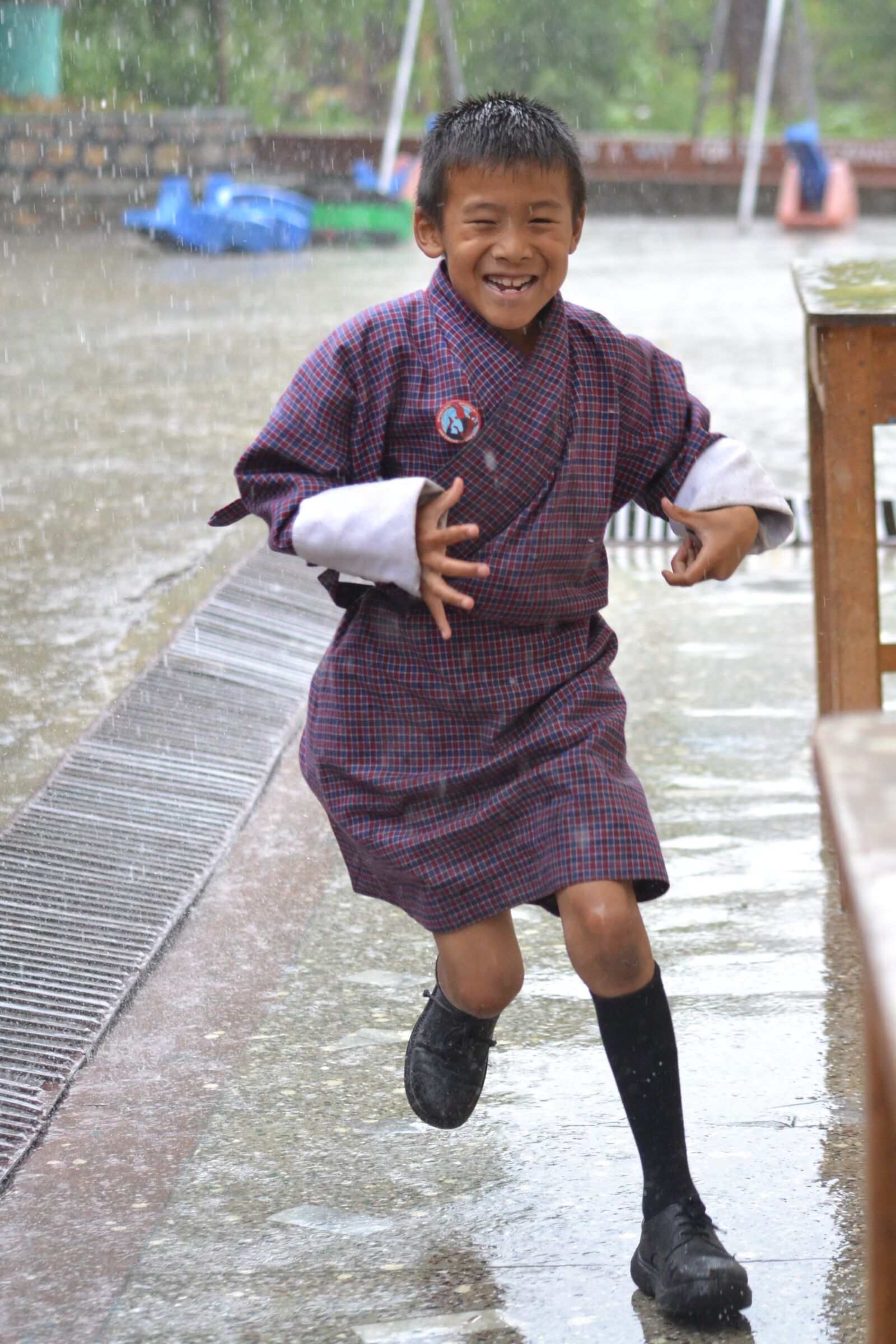 Nikon D3100 sample photo. Boy, running, rain photography