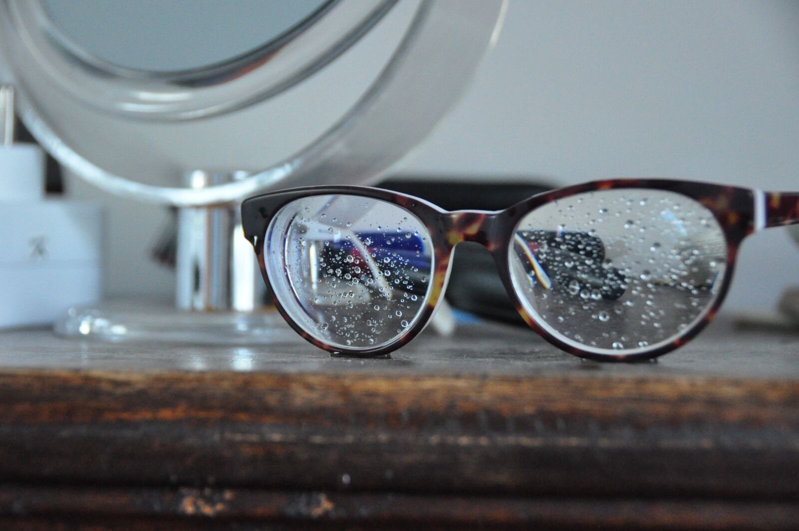 Nikon D90 sample photo. Rain, sunglasses, bathroom photography