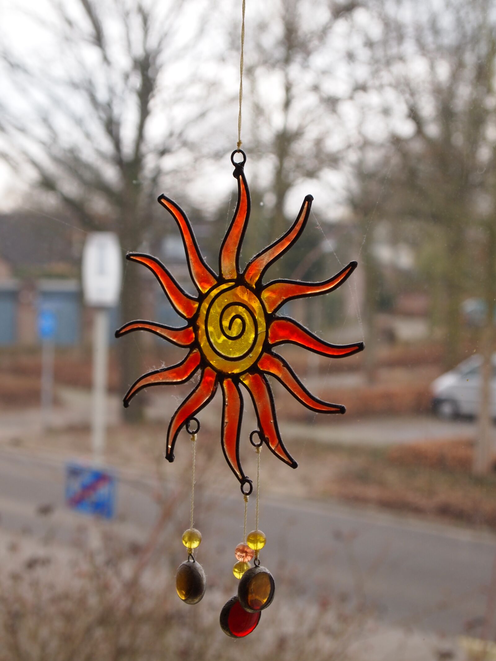 Olympus PEN E-PL1 sample photo. Window, hanger, orange photography