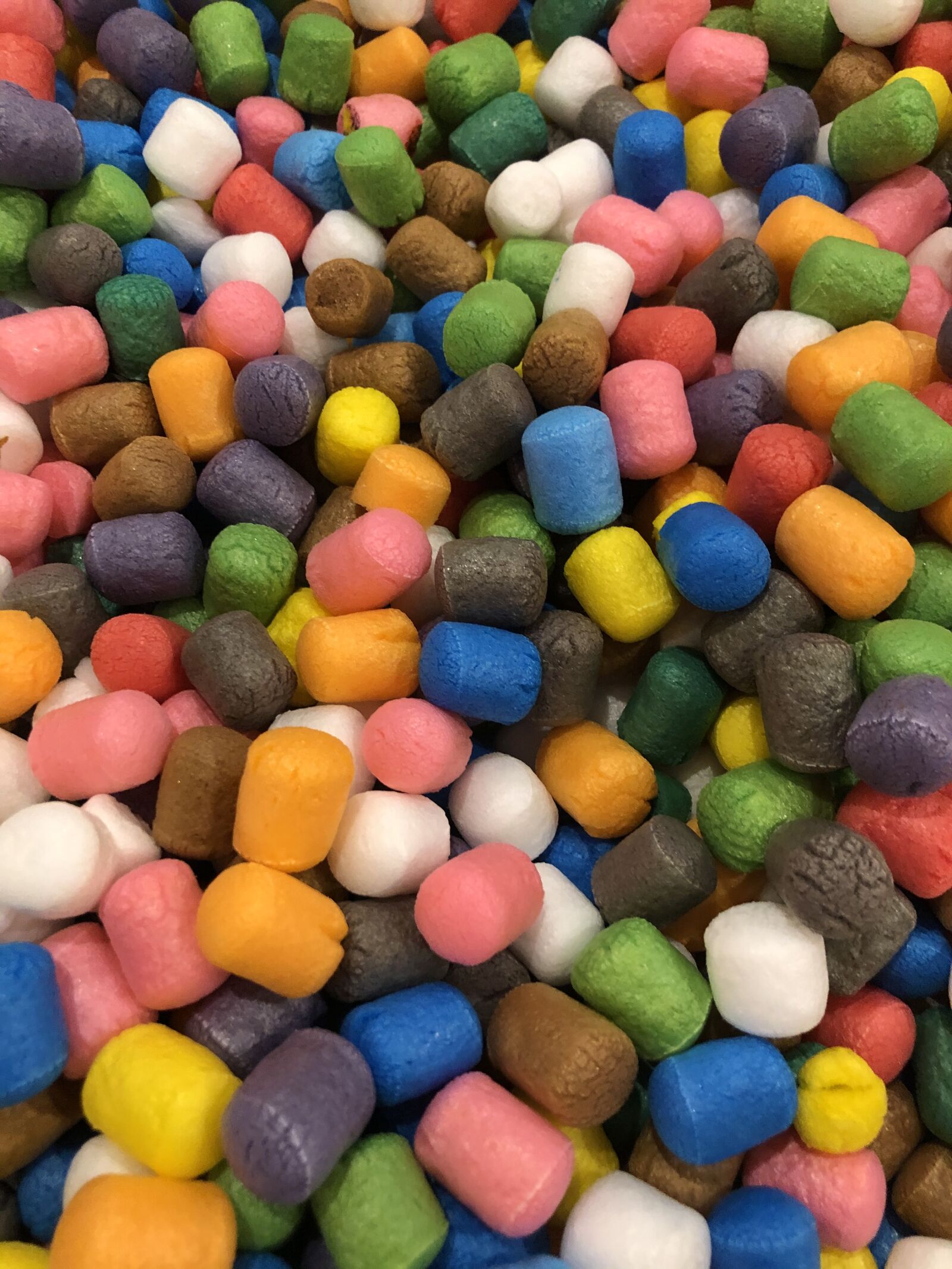 iPhone 8 Plus back dual camera 3.99mm f/1.8 sample photo. Colors, packing peanuts, rainbow photography
