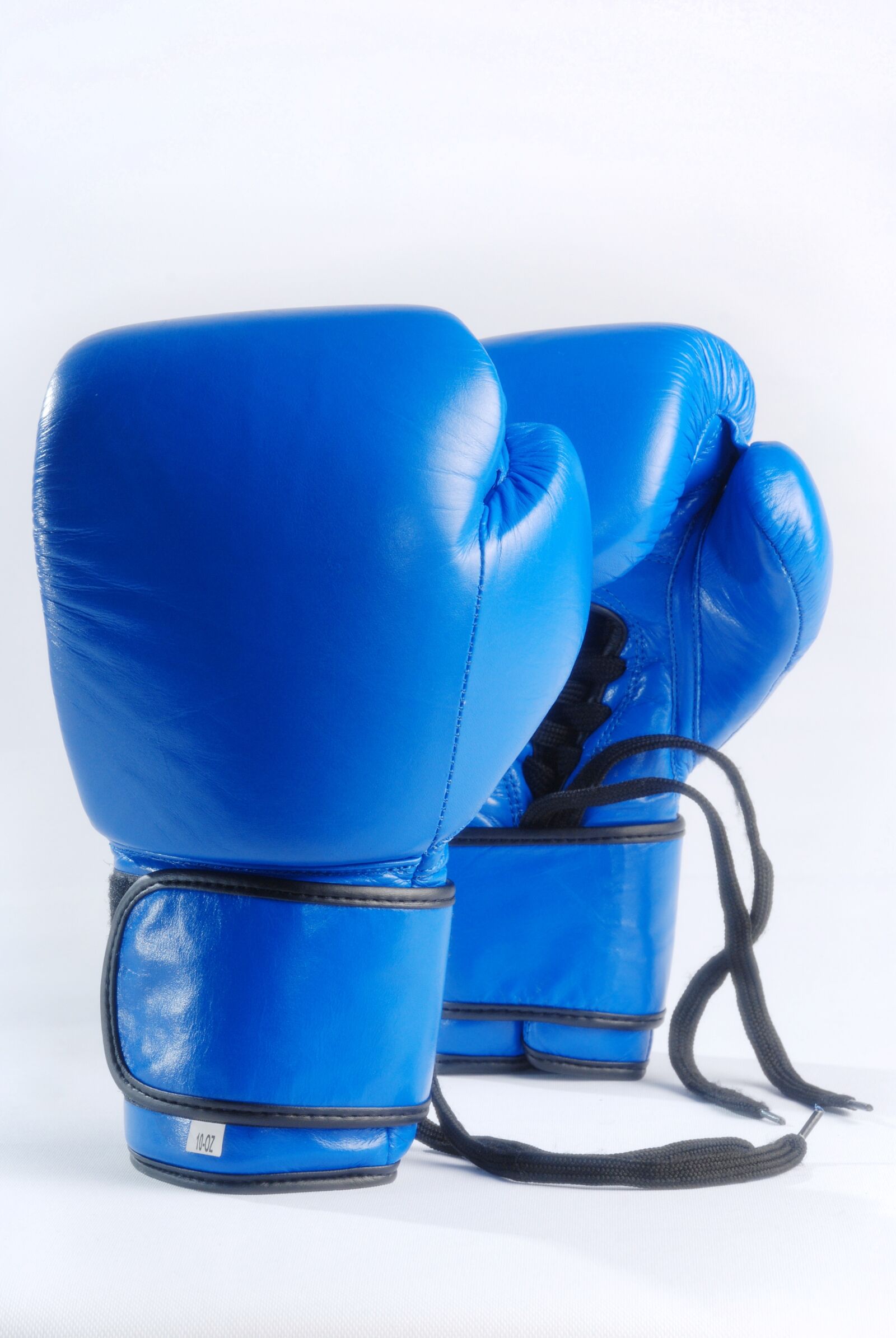 Nikon D80 sample photo. Blue boxing gloves, isolated photography