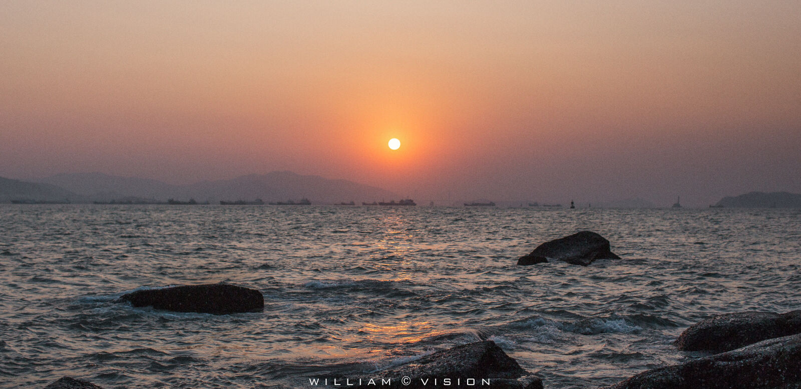 Canon EF 50mm F1.2L USM sample photo. Rock, sea, sunset photography