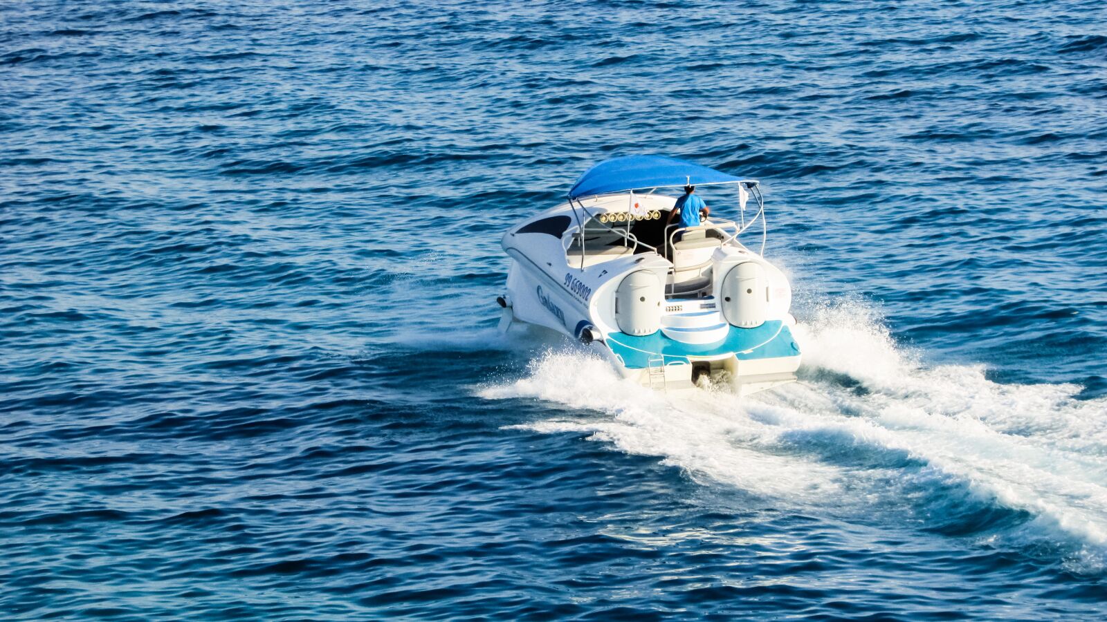 Canon PowerShot SX400 IS sample photo. Speed boat, sea, water photography