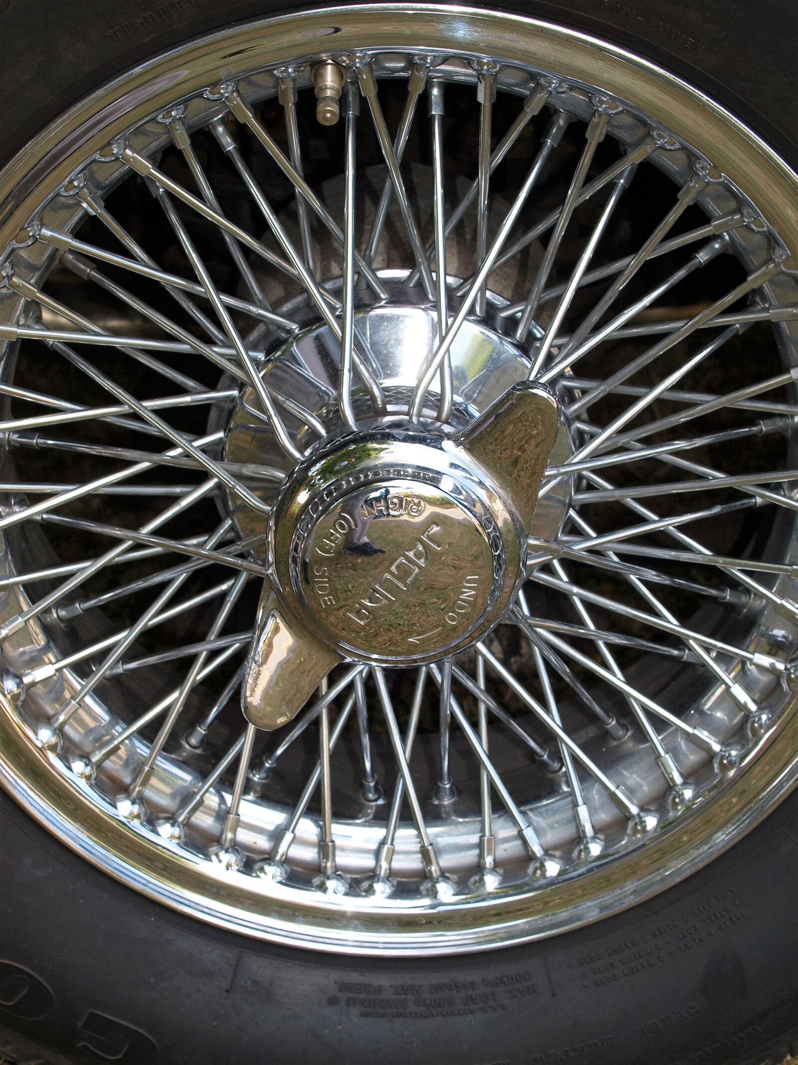 Olympus E-520 (EVOLT E-520) sample photo. Wheel, car, metal photography