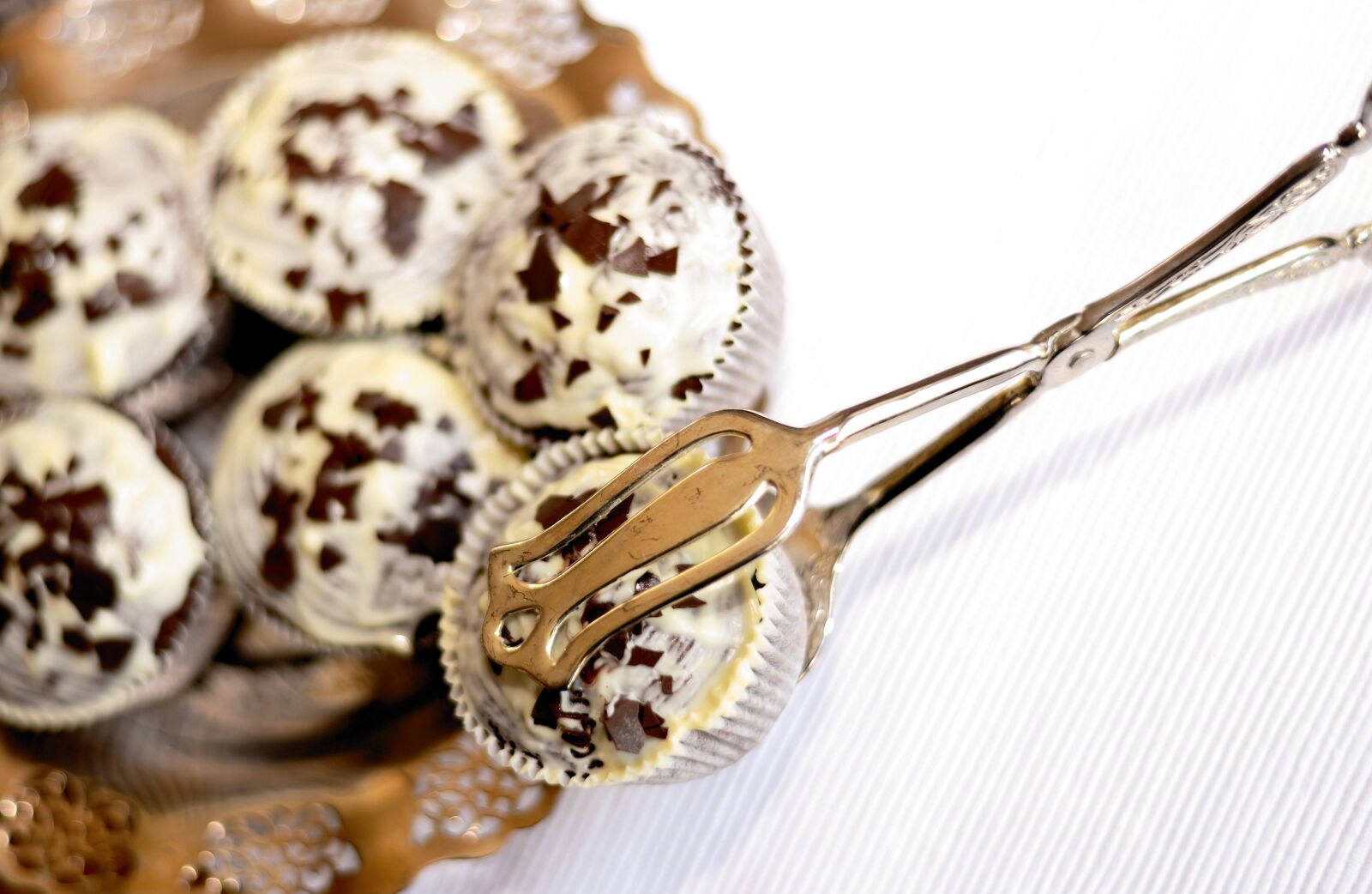 Nikon D610 sample photo. Muffins, pastries, pastry tongs photography