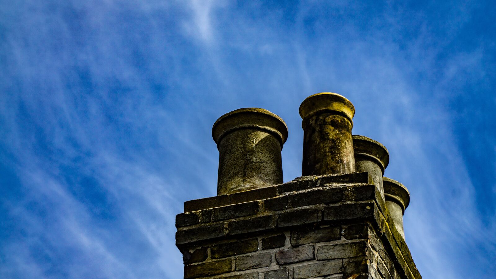 Sony a6000 + Sony E PZ 18-105mm F4 G OSS sample photo. Chimney, sky, pollution photography
