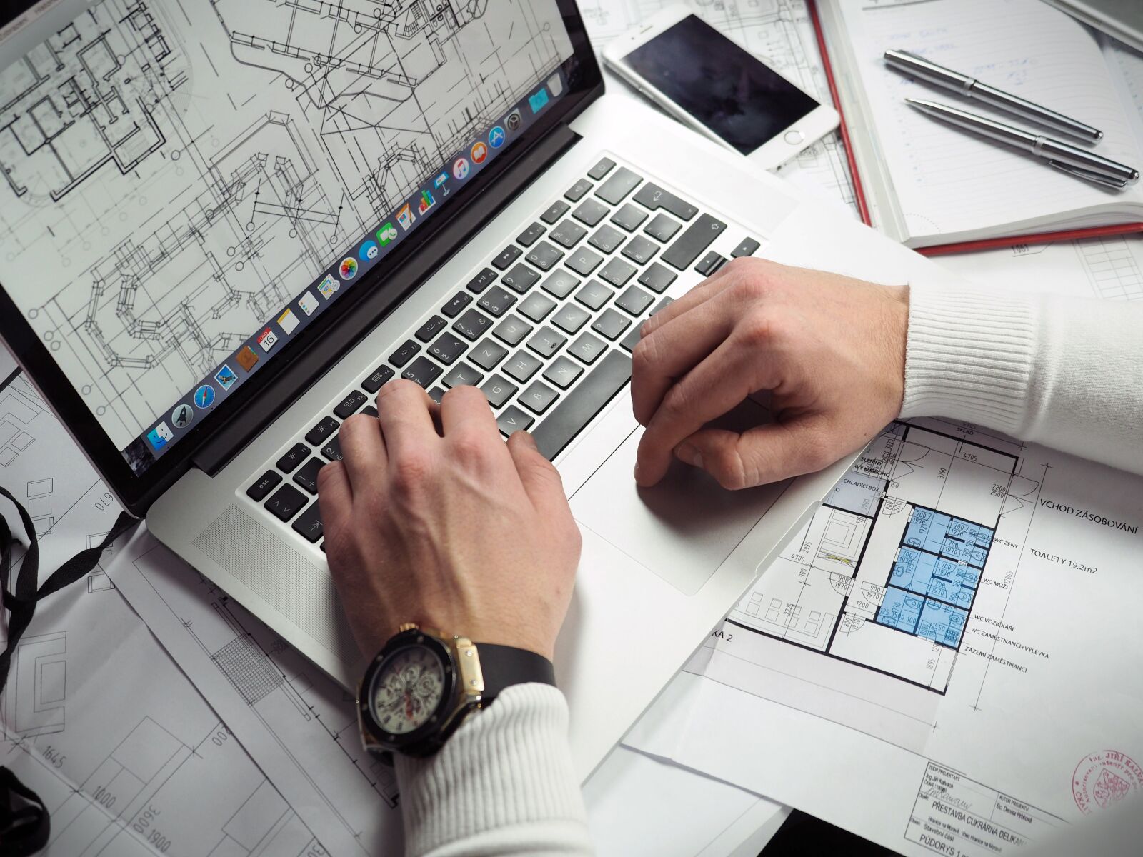 Olympus OM-D E-M5 II + Olympus M.Zuiko Digital ED 12-40mm F2.8 Pro sample photo. Blueprints, entrepreneur, hands photography