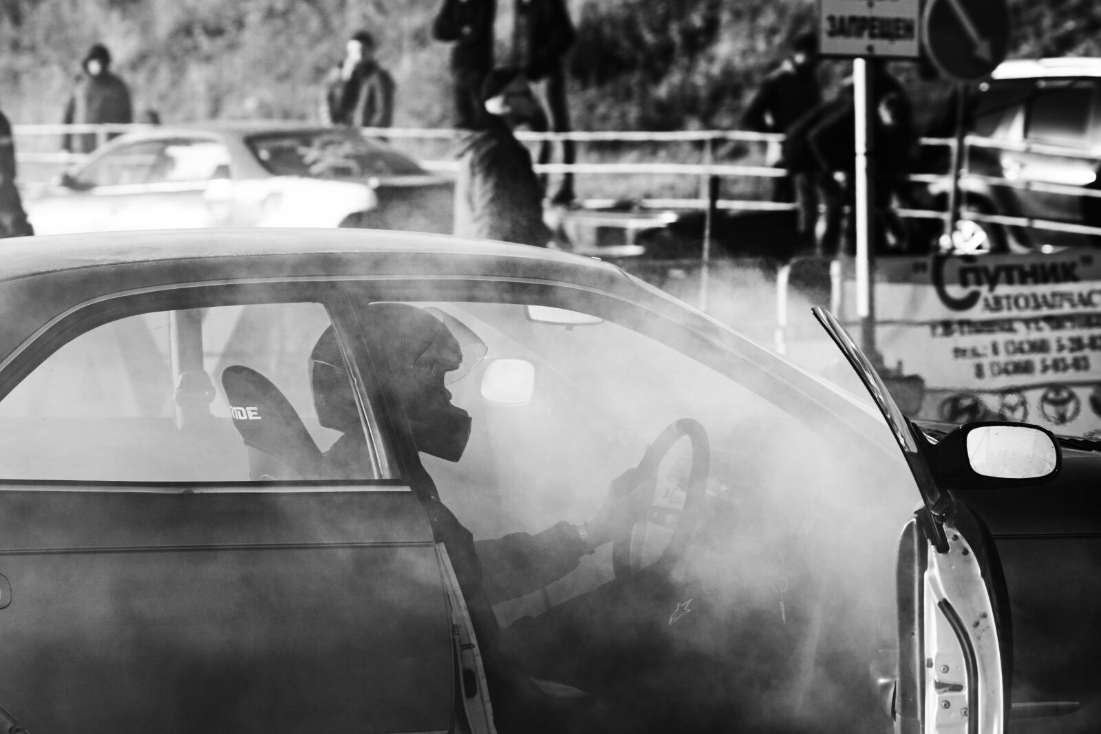 Sony ILCA-77M2 sample photo. Man, car, smoke photography