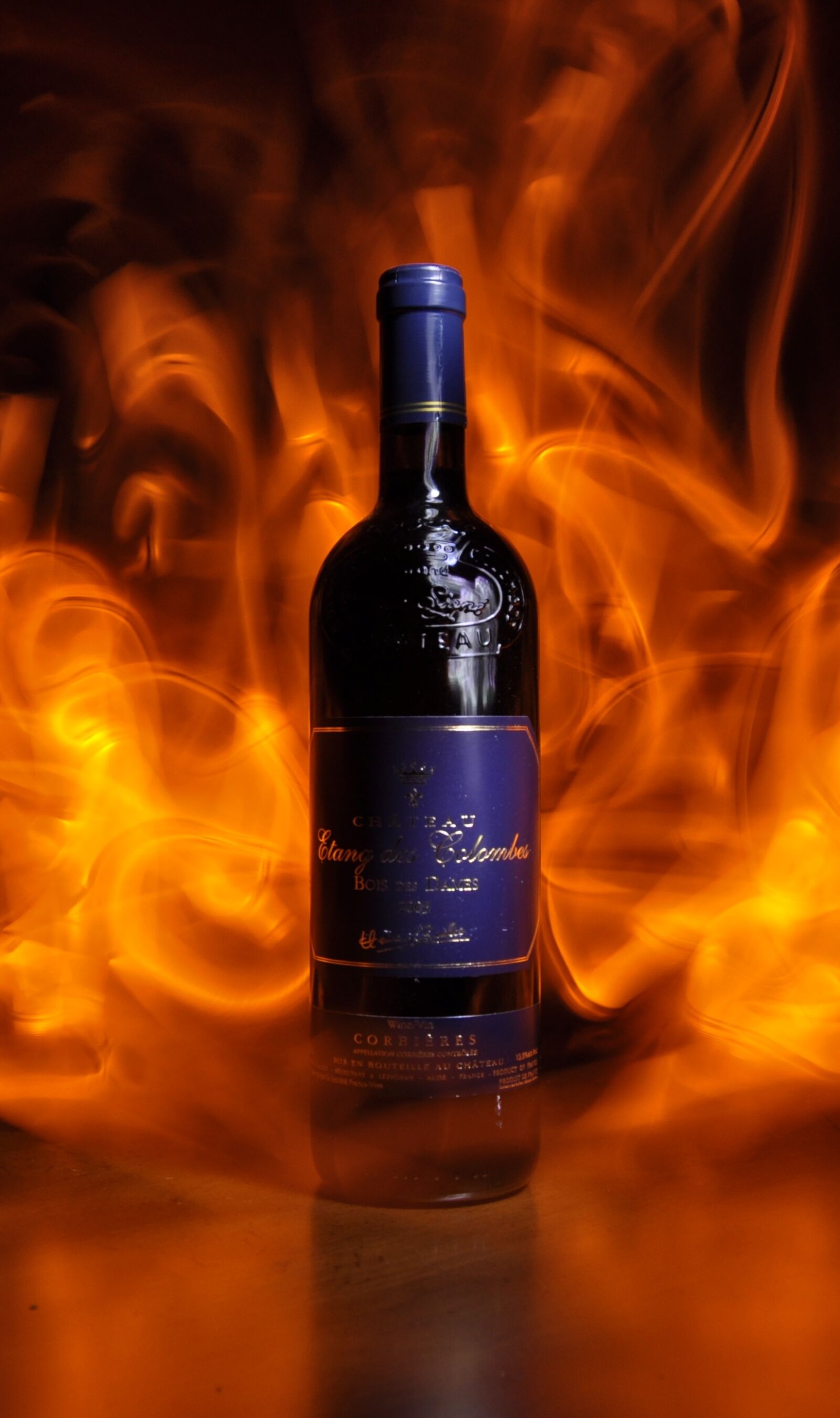 Nikon D5000 sample photo. Wine, bottle, flames photography