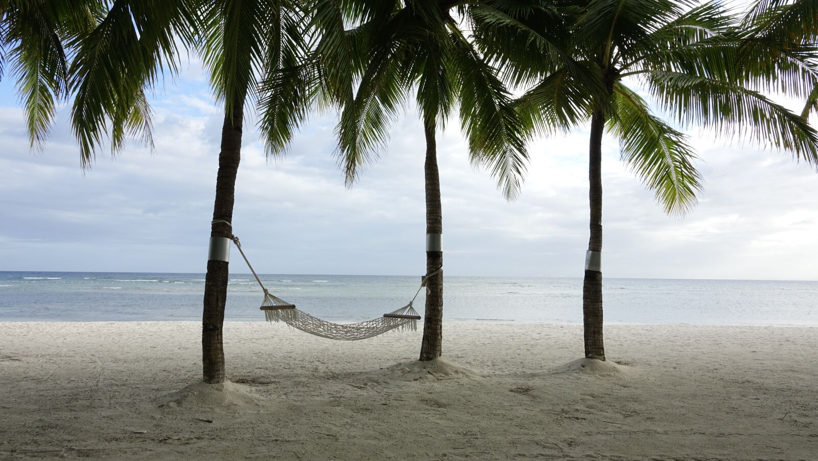 Sony Cyber-shot DSC-RX10 III sample photo. Beach, break, hammock photography