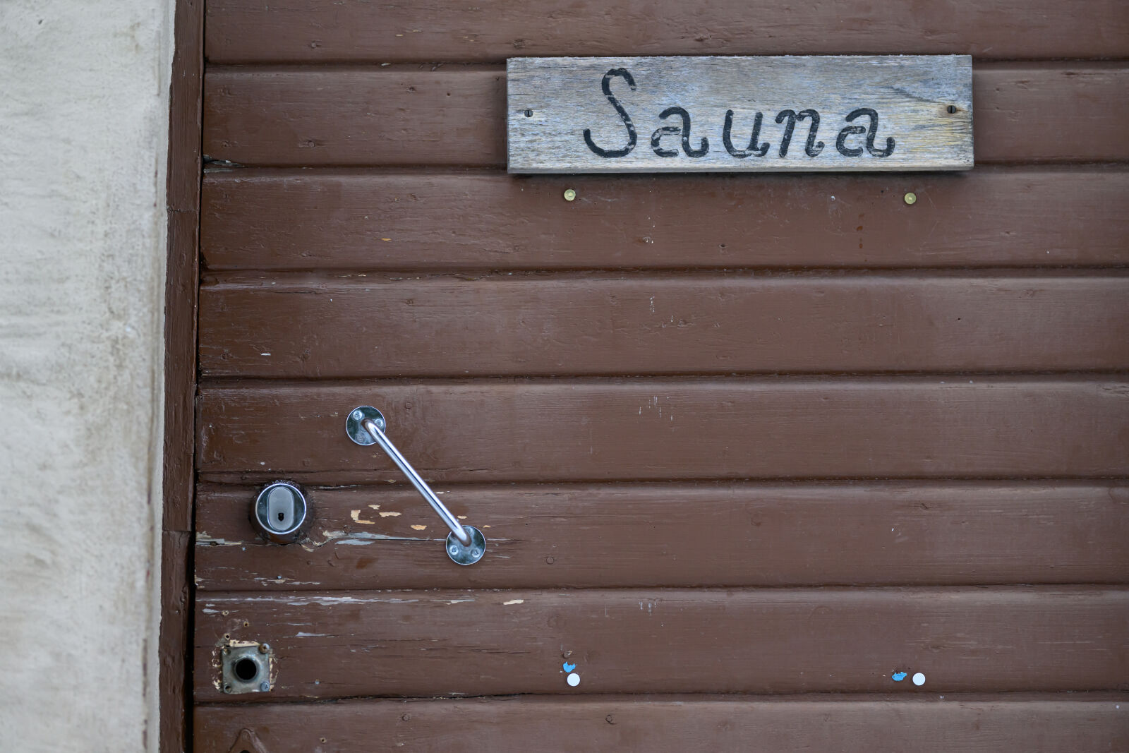 Nikon Nikkor Z 135mm F1.8 S Plena sample photo. Door to sauna photography