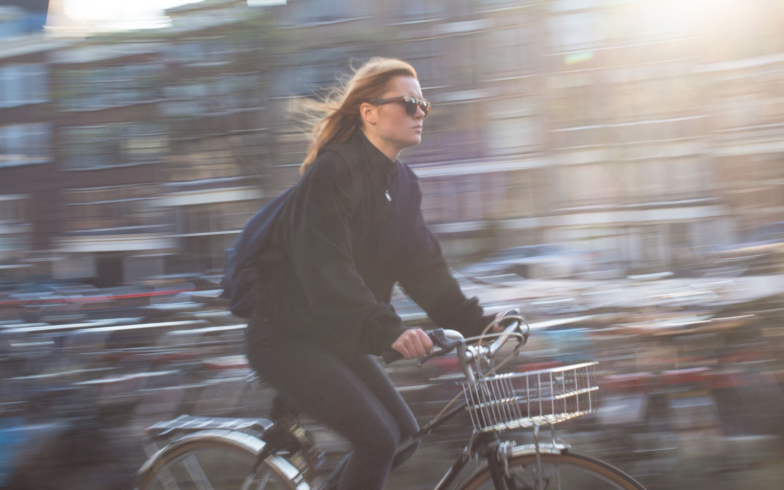 Canon EF 50mm F1.2L USM sample photo. City, girl, bike, speed photography