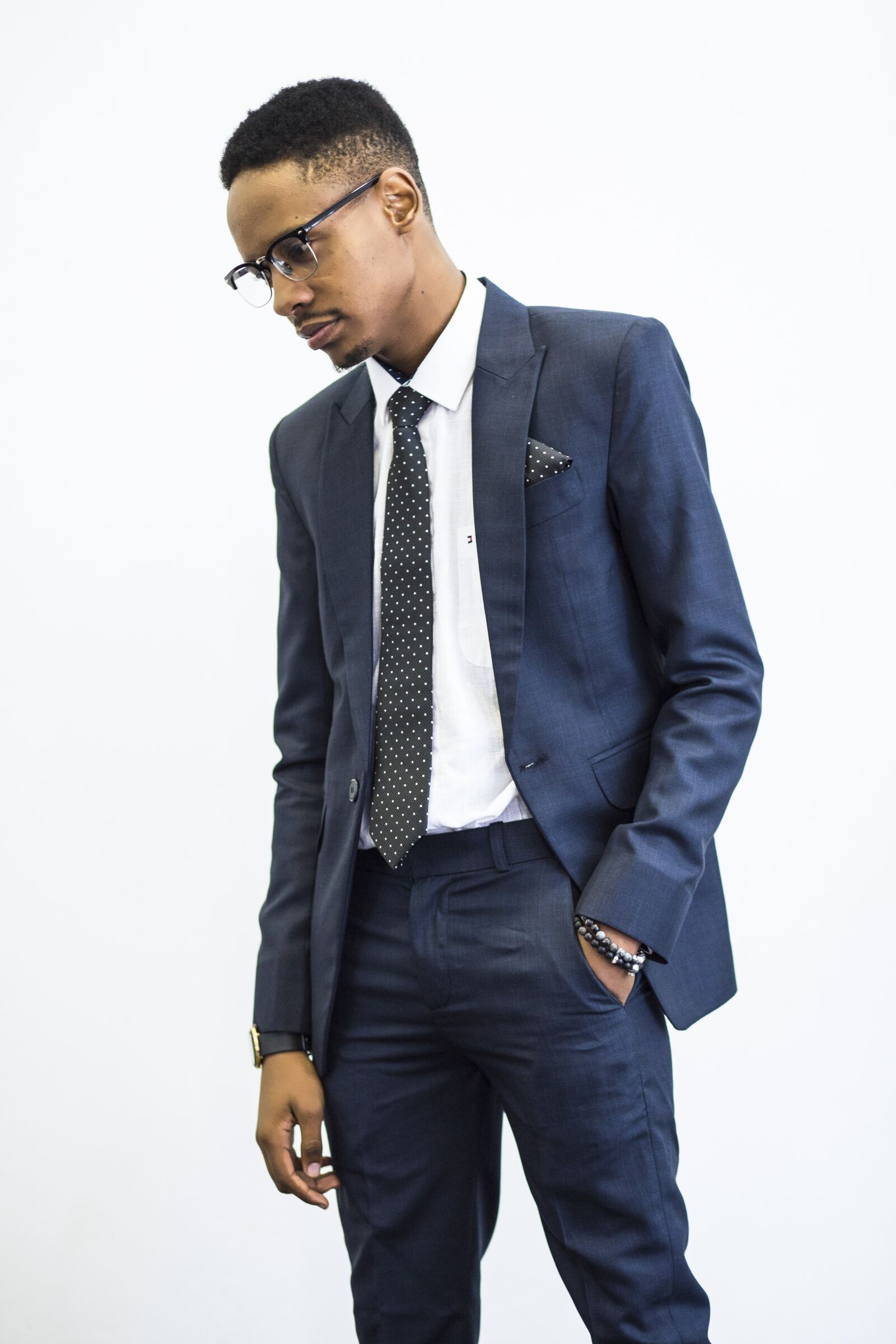 Canon EF 85mm F1.8 USM sample photo. Standing, suit, glasses photography
