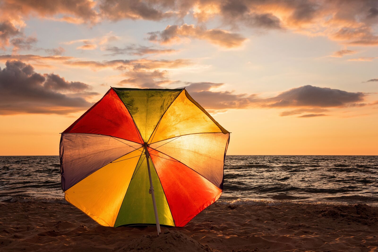 Nikon D810 sample photo. Sunset, beach umbrella, ocean photography