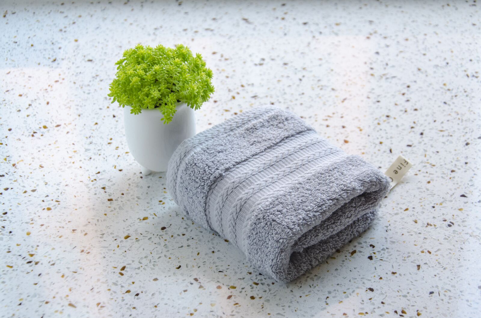 Nikon D7000 sample photo. Gray, towel, green plants photography