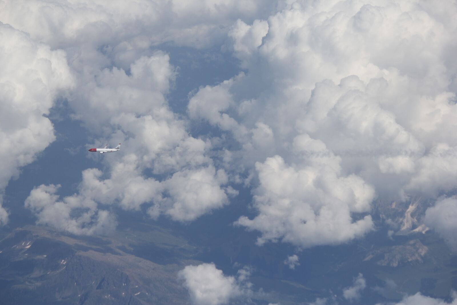 Canon EF-S 55-250mm F4-5.6 IS II sample photo. Plane, clouds, mountains photography