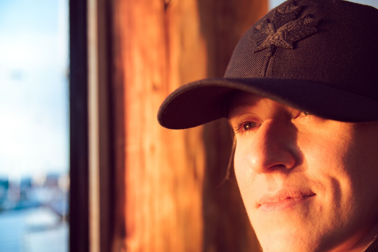 Nikon D750 sample photo. Baseball cap, eyes, happy photography