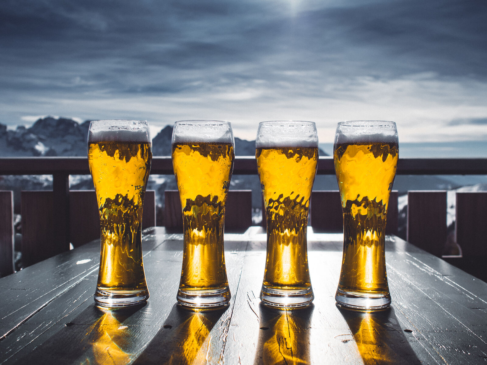 Olympus M.Zuiko Digital 17mm F1.8 sample photo. Four, pint, glasses, filled photography