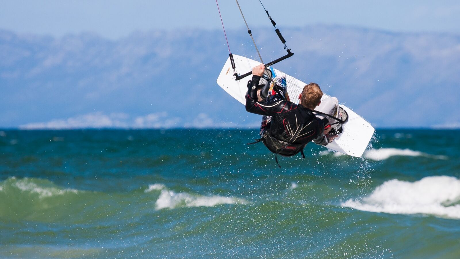 Canon EOS-1D Mark II N sample photo. Kite boarder wave jumping photography