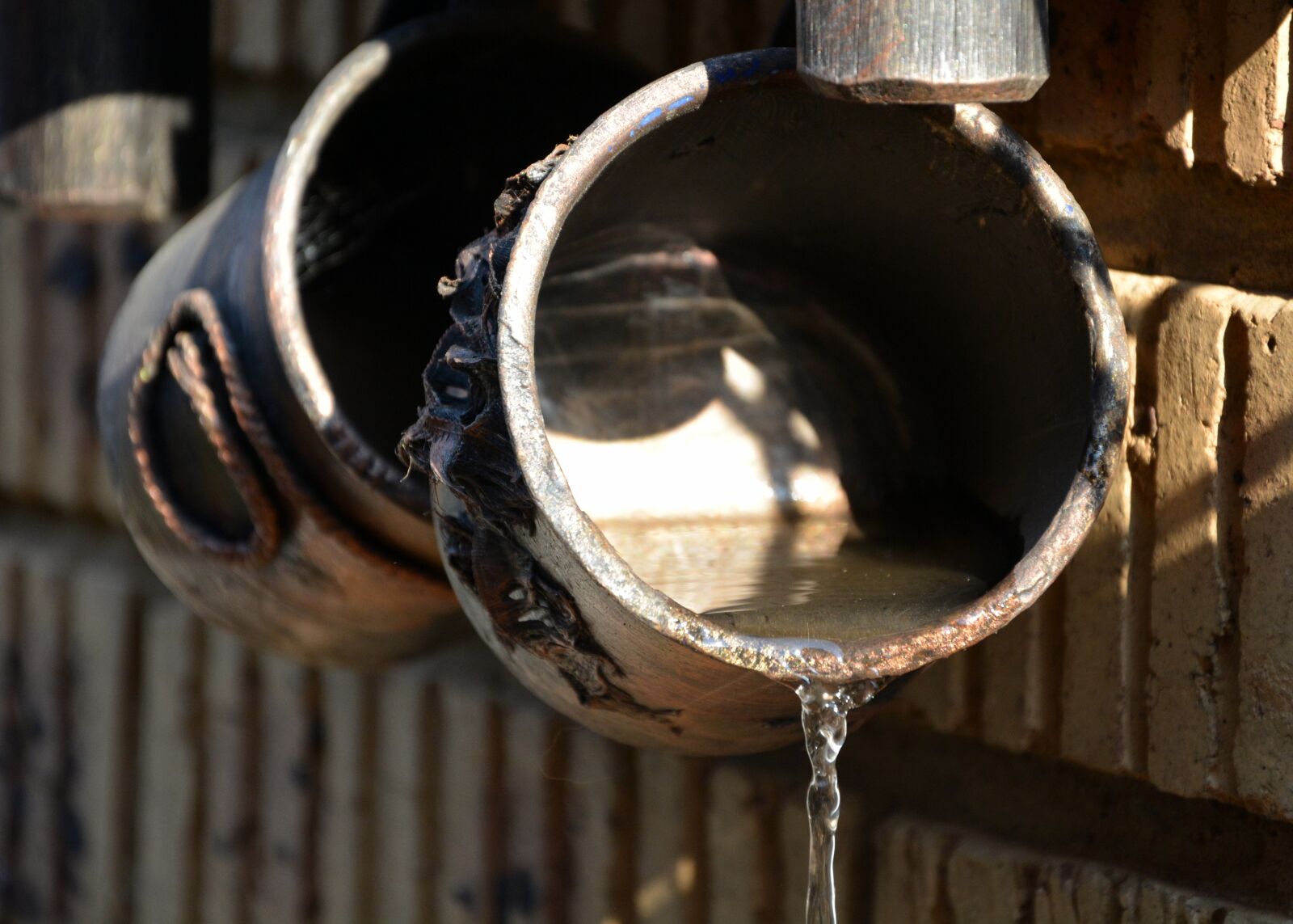 Nikon D5200 sample photo. Water containers, running water photography