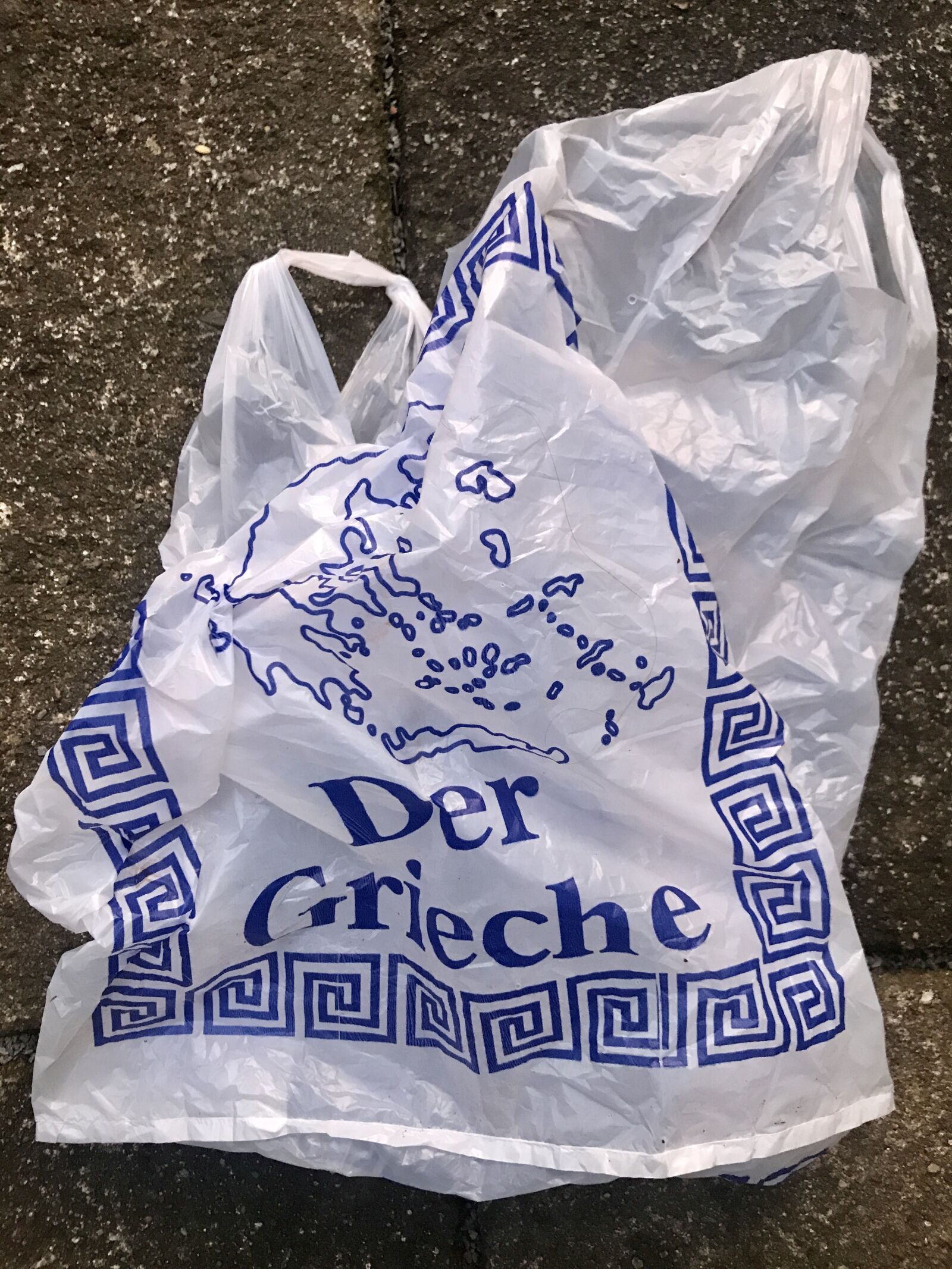 iPhone 7 back camera 3.99mm f/1.8 sample photo. Plastic bag, stone floor photography