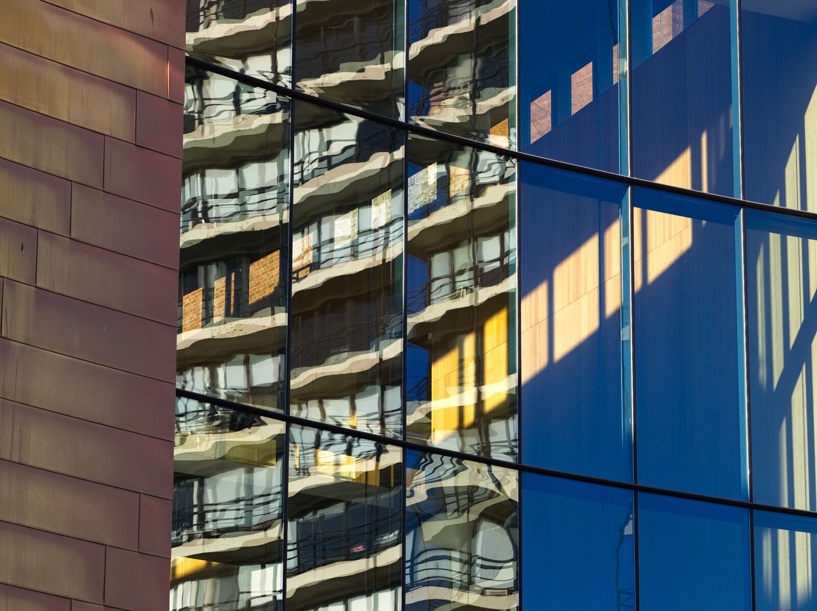 Olympus OM-D E-M5 + Olympus M.Zuiko Digital ED 75mm F1.8 sample photo. Building, window, reflection photography