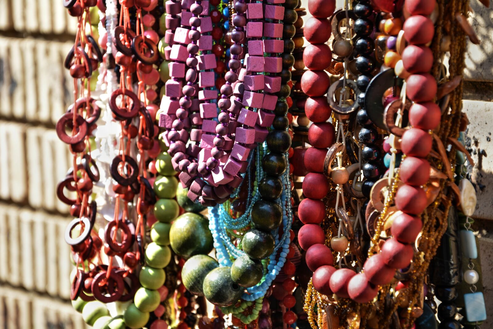 Nikon D5200 sample photo. Beads, neck lace, hand photography