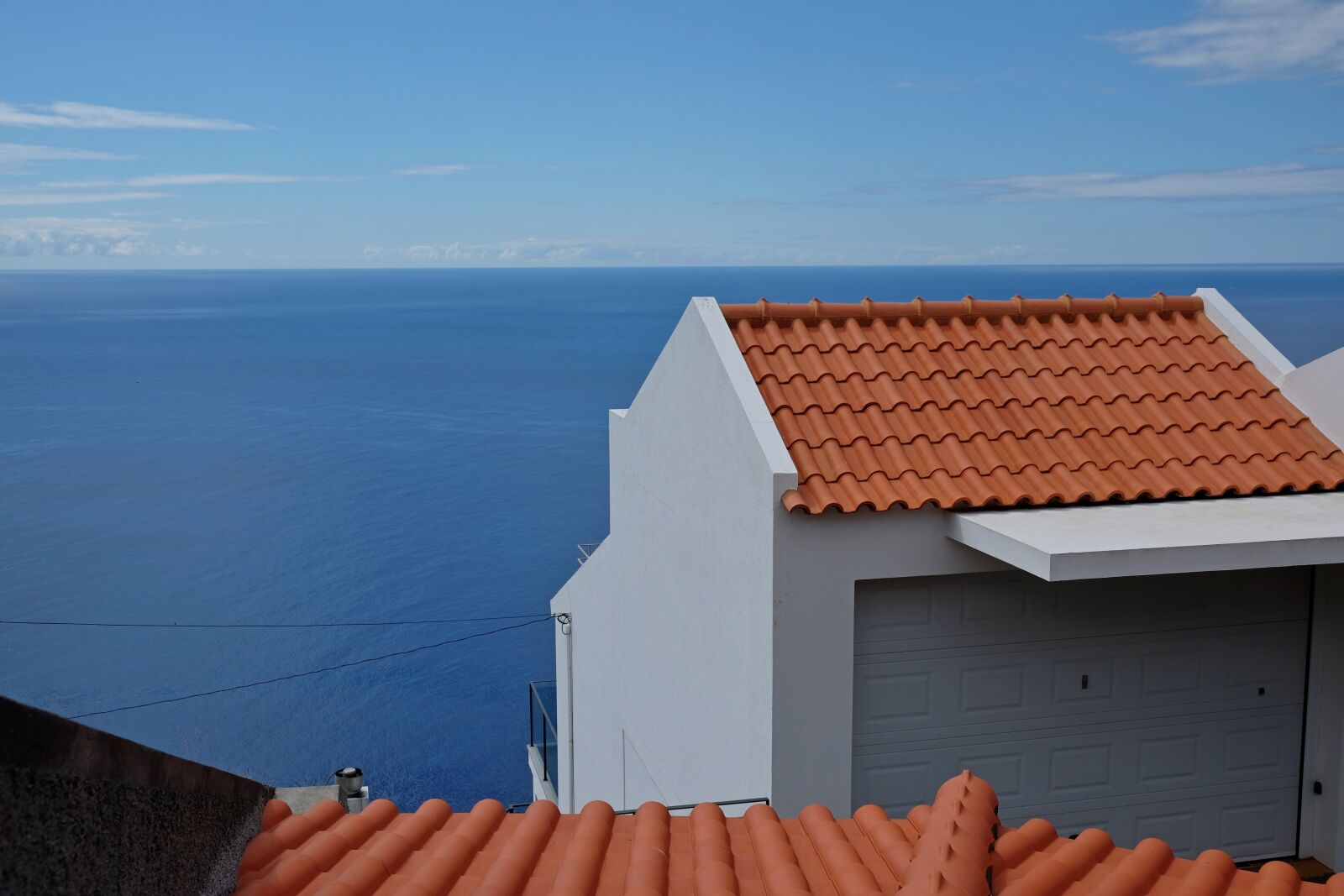 Fujifilm X-T10 sample photo. House, sea, blue photography