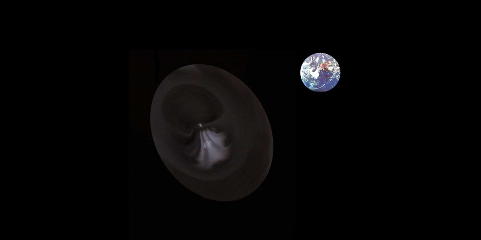 Leica V-LUX 1 sample photo. Earth, black hole, space photography