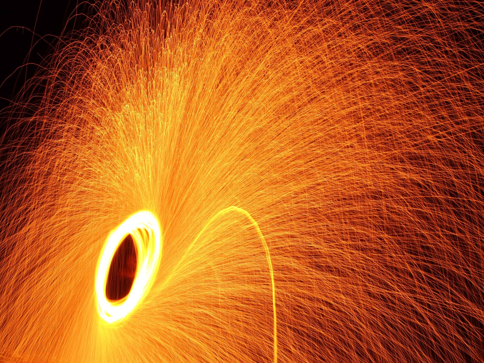 Olympus PEN E-PL1 sample photo. Fire, sparks, night photography