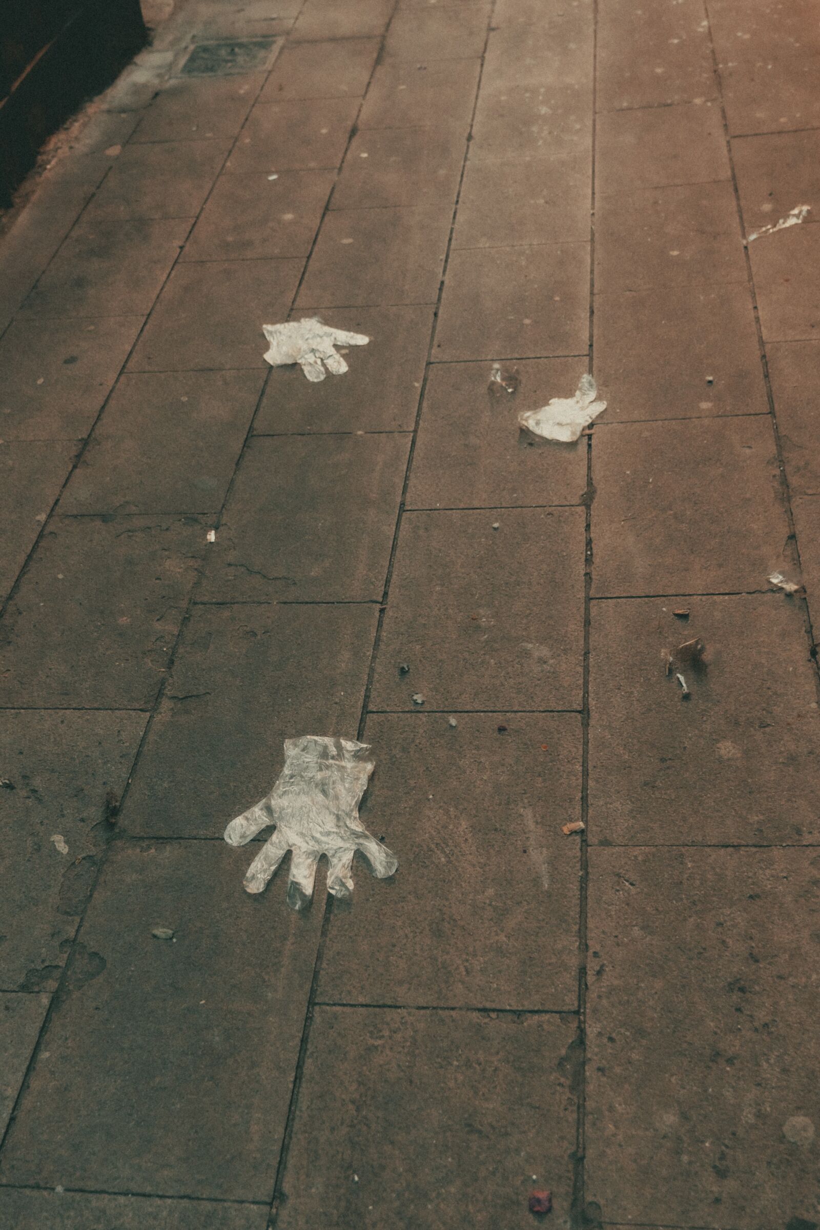 Sony FE 24-105mm F4 G OSS sample photo. Gloves, dirty, streets photography
