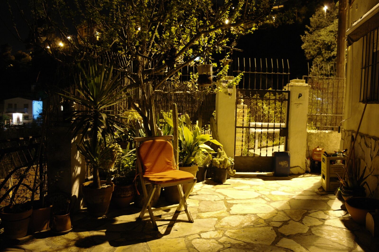 Samsung NX10 sample photo. Night, patio, chair photography