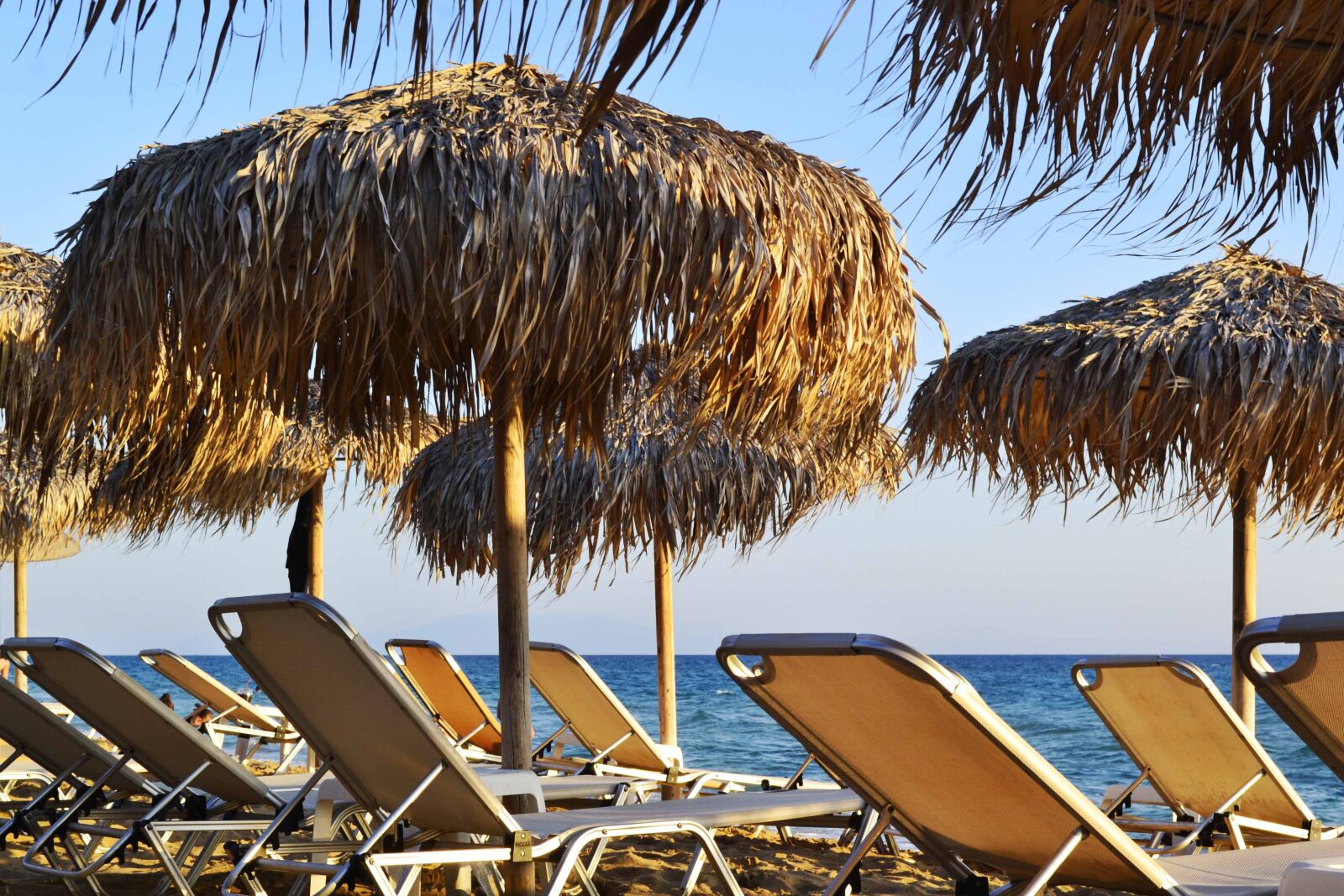 Nikon D3100 sample photo. Sunbeds and umbrellas, seaside photography