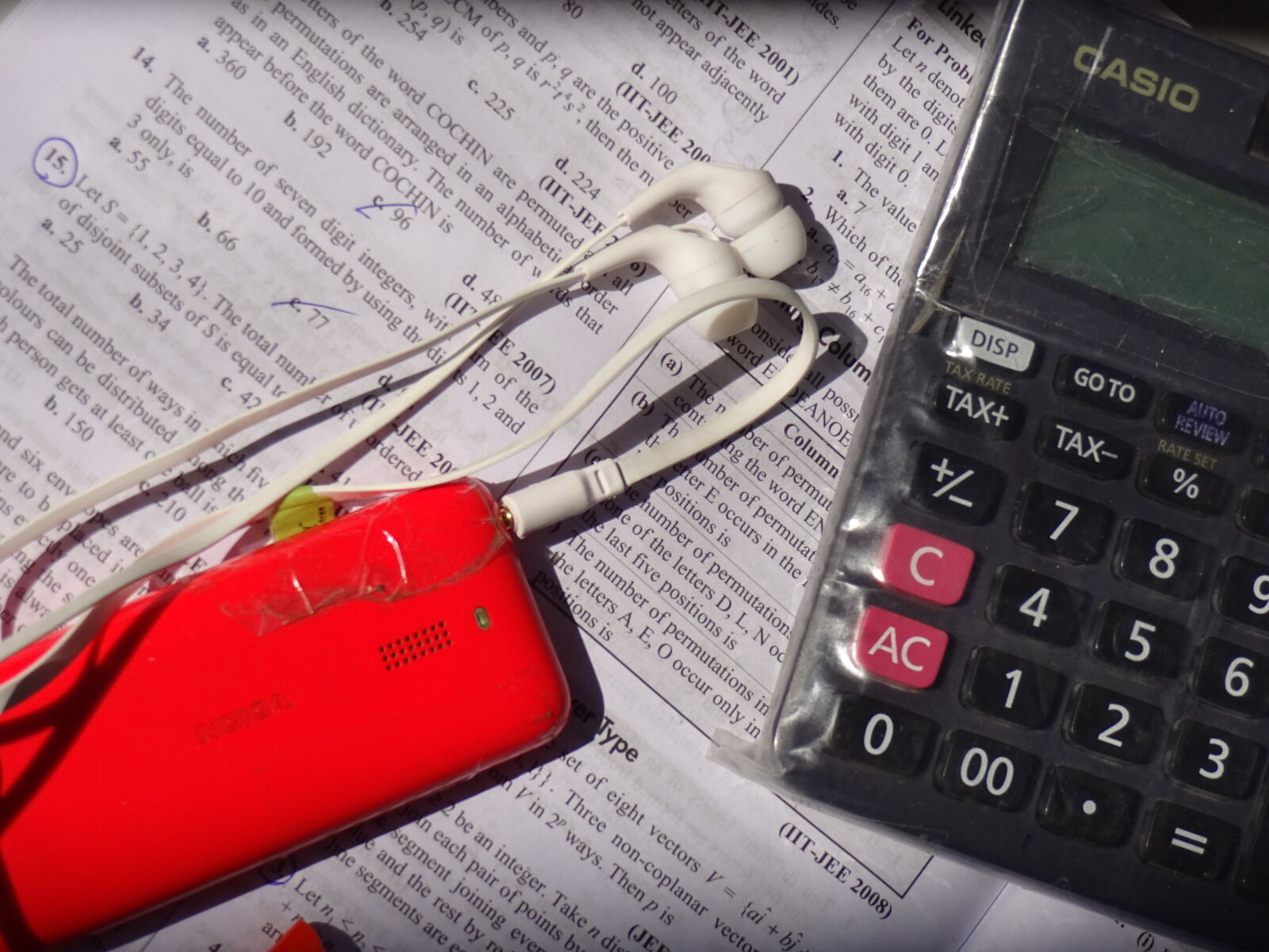 Sony Cyber-shot DSC-WX220 sample photo. Book, calculator, handsfree, listening photography
