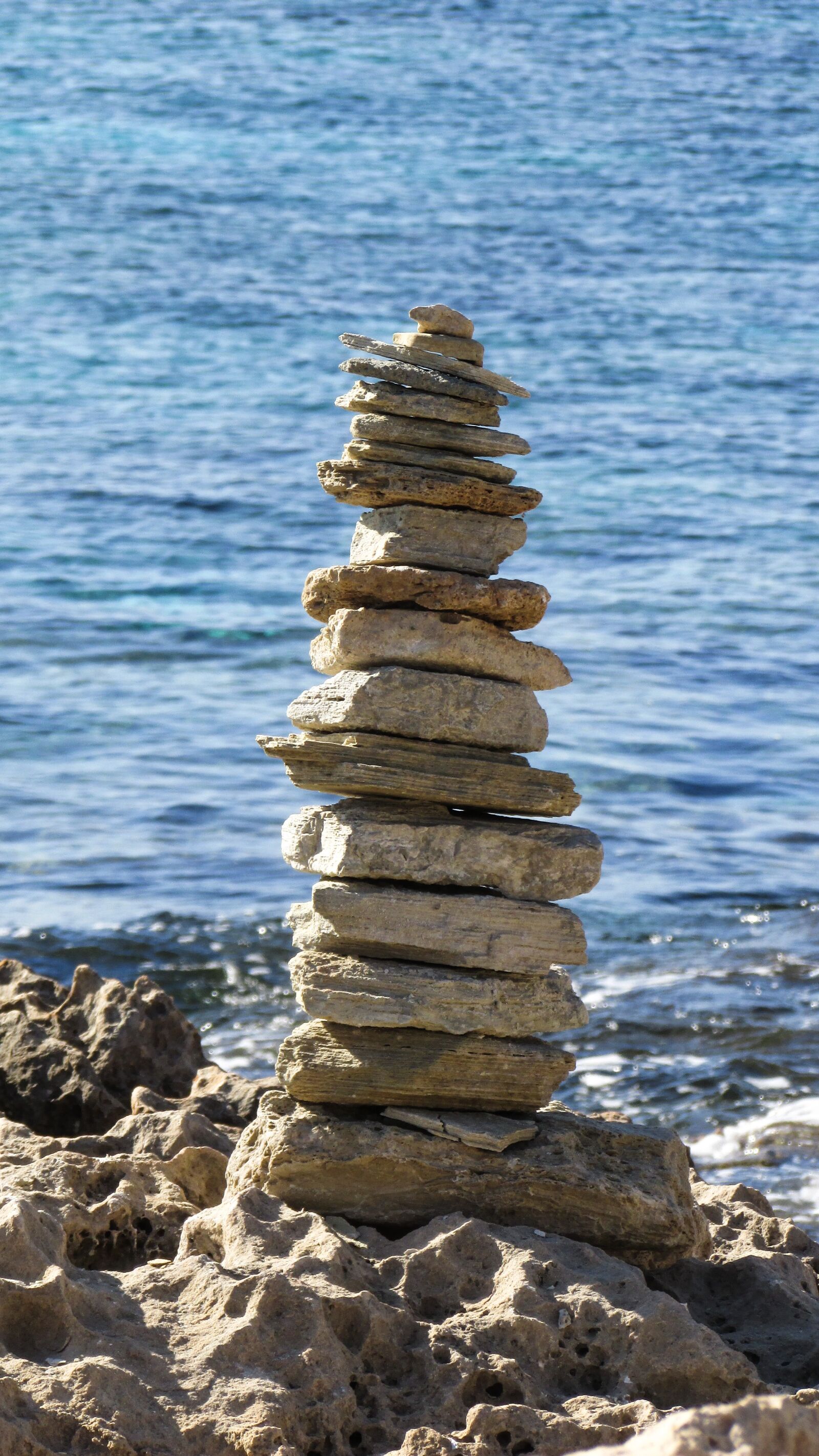 Canon PowerShot SX400 IS sample photo. Stones, tower, sign photography