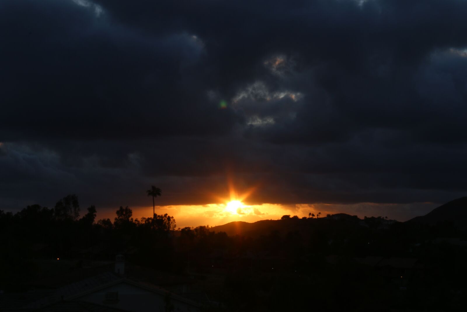 Canon EF-S 18-200mm F3.5-5.6 IS sample photo. Sunset, bright sky, dark photography