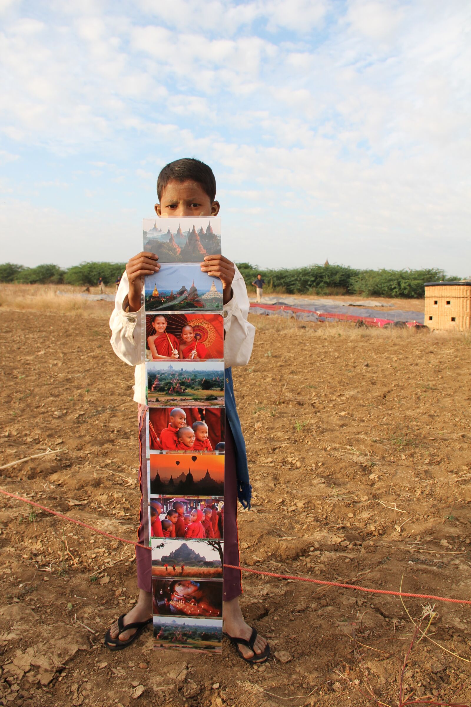 Canon EF-S 18-135mm F3.5-5.6 IS sample photo. Boy, seller, postcards photography