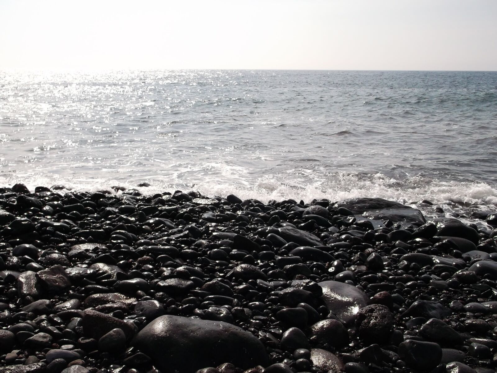 Fujifilm FinePix AX300 sample photo. Ocean, stones, beach photography