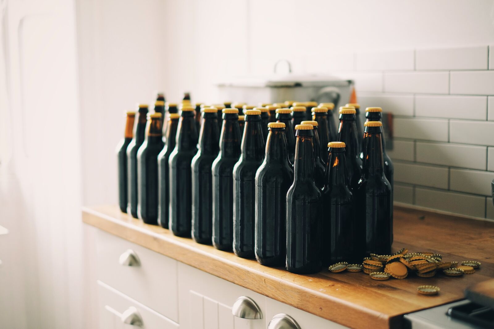 Fujifilm X-Pro1 + Fujifilm XF 35mm F1.4 R sample photo. Bottle caps, beer bottles photography